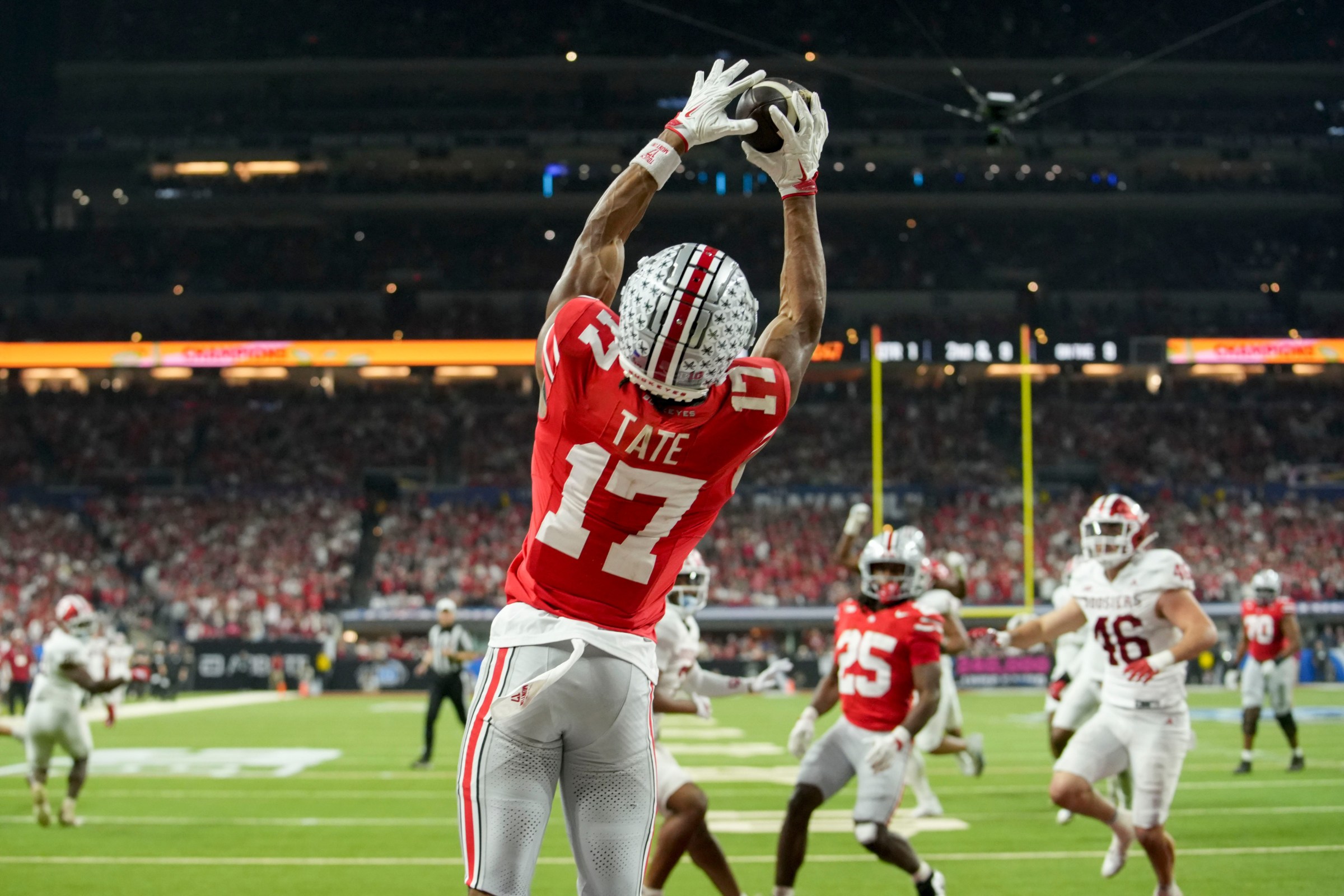 Ohio State Buckeyes wide receiver Carnell Tate (17) makes a catch for a touchdown Saturday, Dec. 6, 2025, during the Big Ten football championship against the Indiana Hoosiers at Lucas Oil Stadium in Indianapolis.