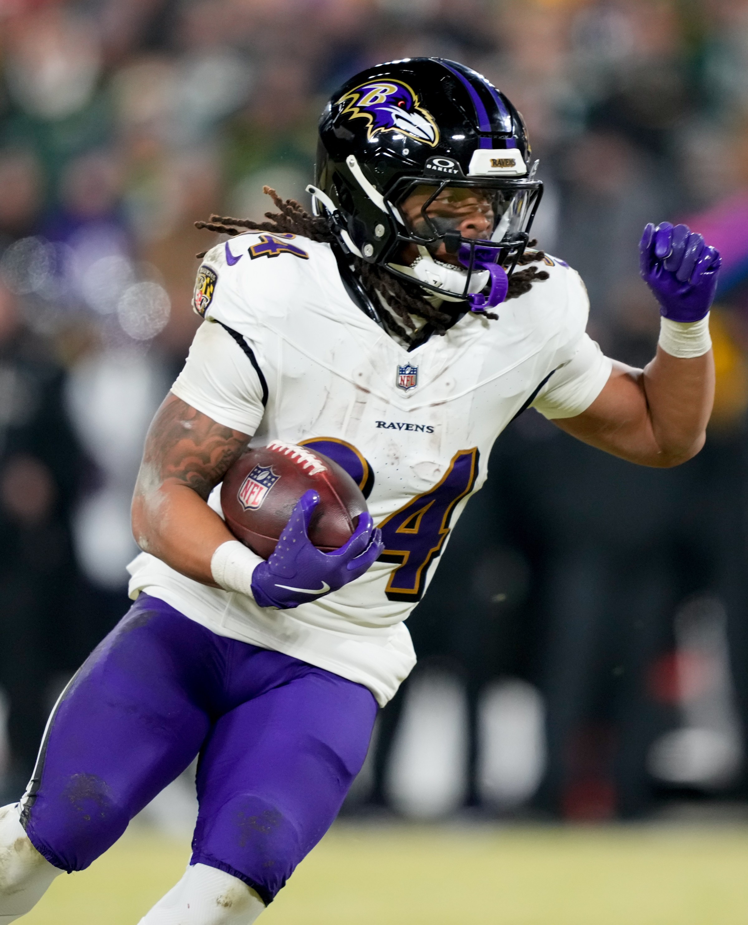 Dec 27, 2025; Green Bay, Wisconsin, USA; Baltimore Ravens running back Keaton Mitchell (34) runs the ball during the fourth quarter against the Green Bay Packers at Lambeau Field. Mandatory Credit: Kayla Wolf-Imagn Images