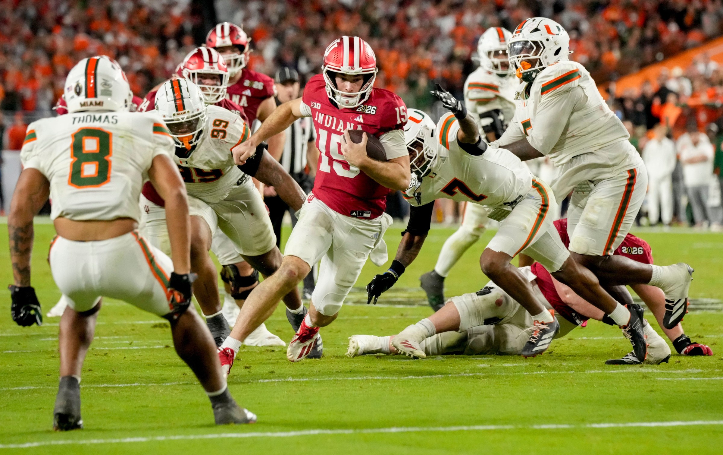 Indiana quarterback Fernando Mendoza (15) rushes into the end zone for a touchdown against Miami during the College Football Playoff national championship game at Hard Rock Stadium in Miami Gardens, Fla., on Jan. 19, 2026.