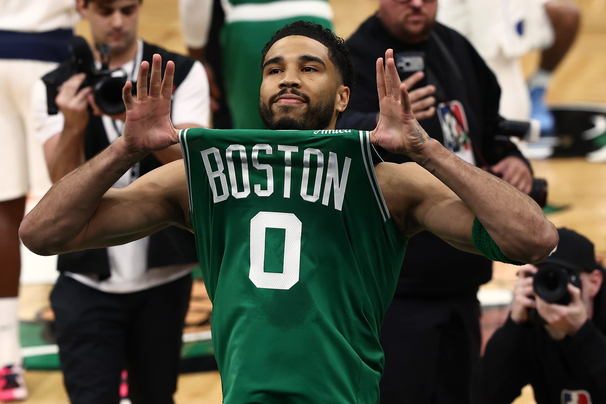Mar 6, 2026; Boston, Massachusetts, USA; Boston Celtics forward Jayson Tatum (0) shows his jersey to the crowd before taking the court for the first quarter against the Dallas Mavericks at TD Garden. Mandatory Credit: Winslow Townson-Imagn Images