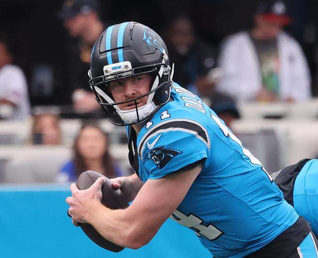 Carolina Panthers quarterback Andy Dalton looks for an opening Sunday, Oct. 26, 2024 at Bank of America Stadium in Charlotte.