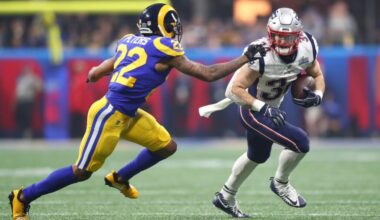 New England Patriots running back Rex Burkhead (34) runs against Los Angeles Rams cornerback Marcus Peters (22) in the fourth quarter in Super Bowl LIII at Mercedes-Benz Stadium.