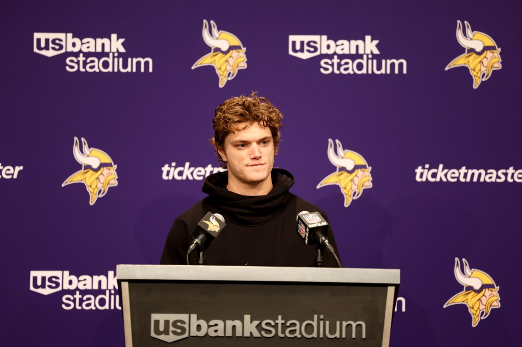 Minnesota Vikings quarterback J.J. McCarthy speaking at a news conference.