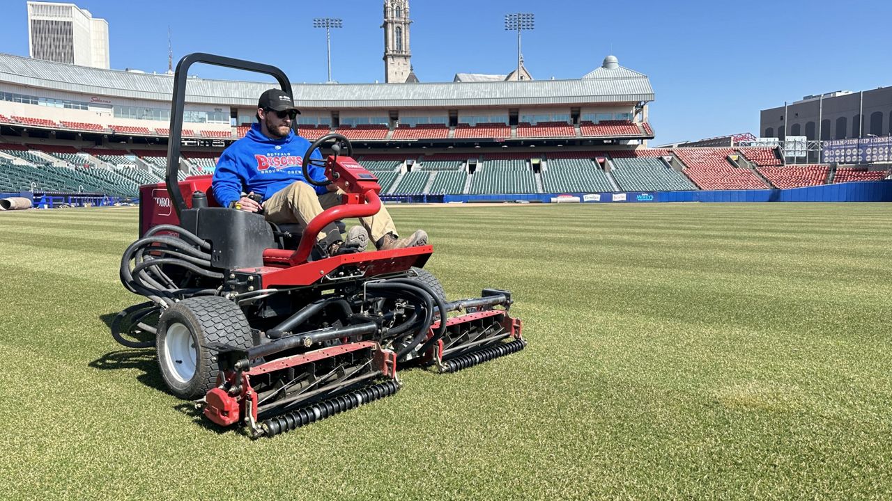 Jeff Smolka, Buffalo Bisons groundskeeper, mows the lawn for the first time in 2024 at Sahlen Field ahead of the team's March 29th home opener. (AP Photo)
