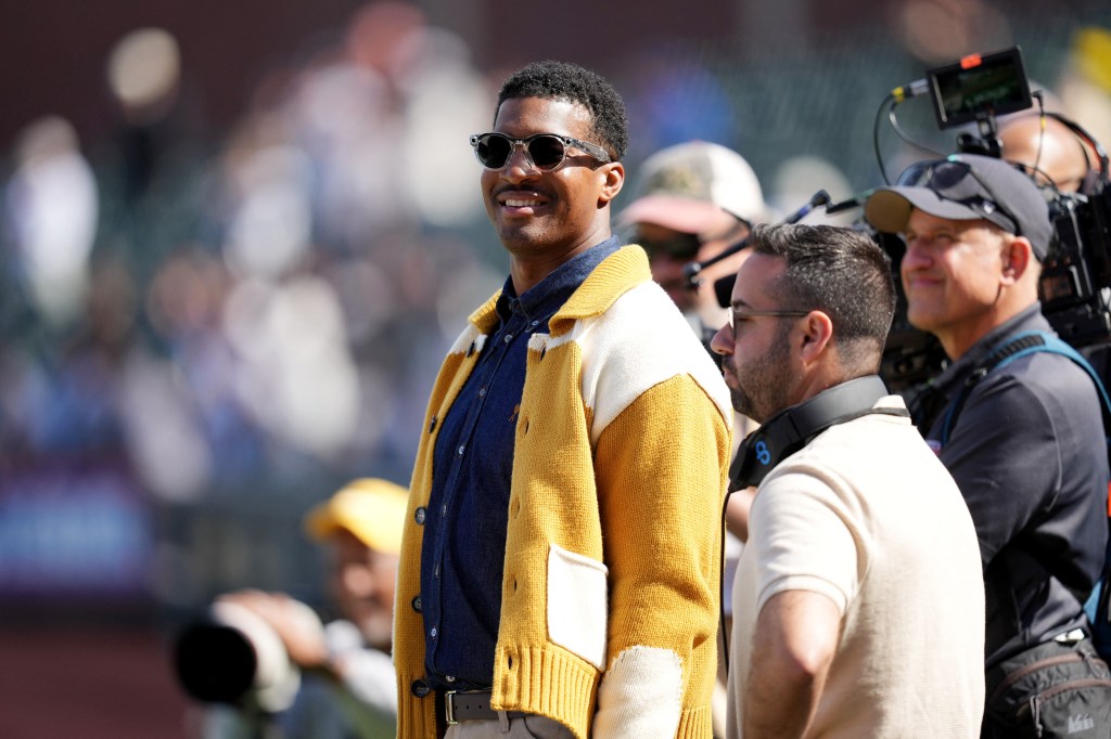 New York Giants quarterback Jameis Winston standing on the field.