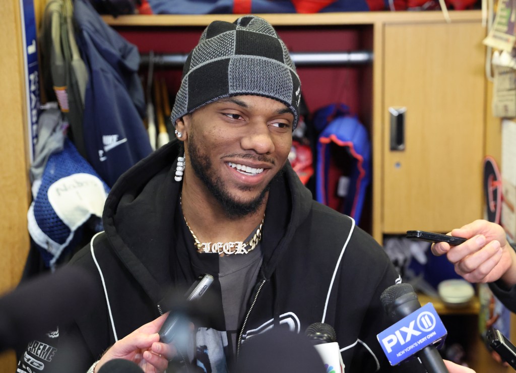 Malik Nabers speaking to media at the New York Giants training facility.