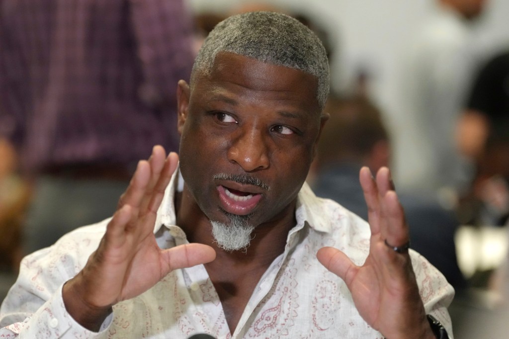 Aaron Glenn speaking to reporters at the NFL annual league meetings.