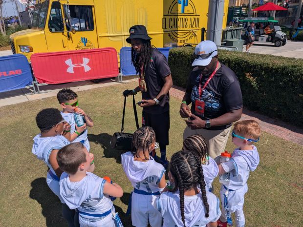 Some of the Fitchburg based Central Mass Gators athletes with their coaches at the 4th Annual Youth Flag Football World Championships held at the ESPN Wide World Of Sports Complex in Orlando this month. (SUBMITTED PHOTO)
