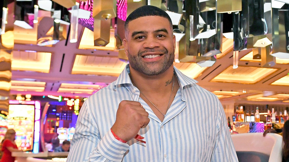 Shawne Merriman poses with fist up