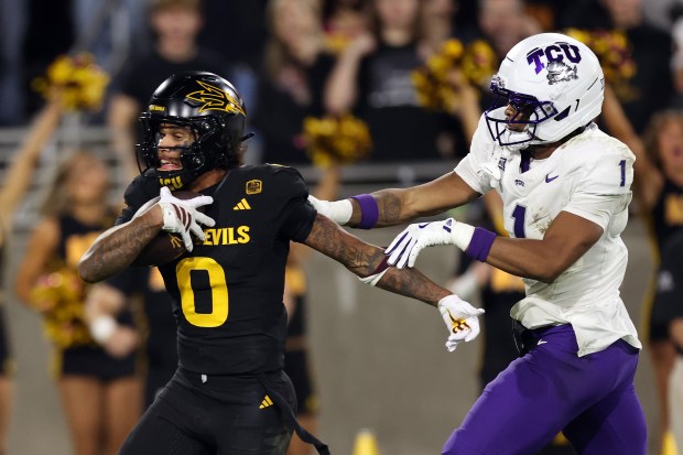 Arizona State wide receiver Jordyn Tyson (0) slips by TCU safety Austin Jordan (1) for a touchdown during the first half at Mountain America Stadium on Sept. 26, 2025, in Tempe, Arizona. (Chris Coduto/Getty Images/TNS)