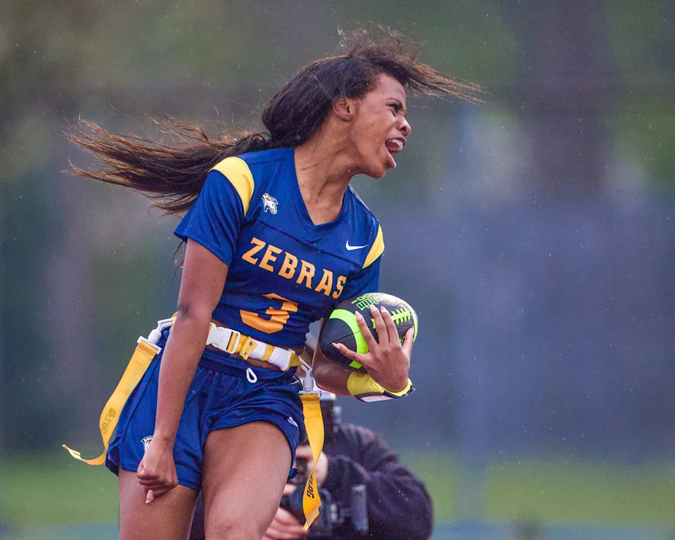 Wayne Memorial's Laylah Brown celebrates a TD during a Michigan Girls High School Flag Football League game on Friday, April 24, 2026.