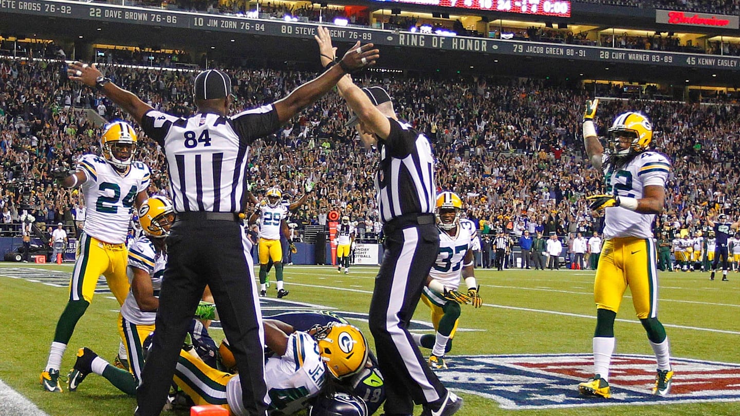 Officials indicate opposite rulings during the Green Bay Packers' 14-12 loss to the Seattle Seahawks on September 24, 2012