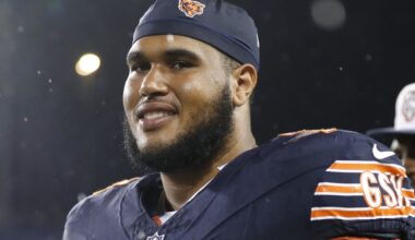 Aug 1, 2024; Canton, Ohio, USA;  Chicago Bears offensive tackle Larry Borom (75) joins teammates in exiting the field due to lightning during the third quarter against the Houston Texans at Tom Benson Hall of Fame Stadium.