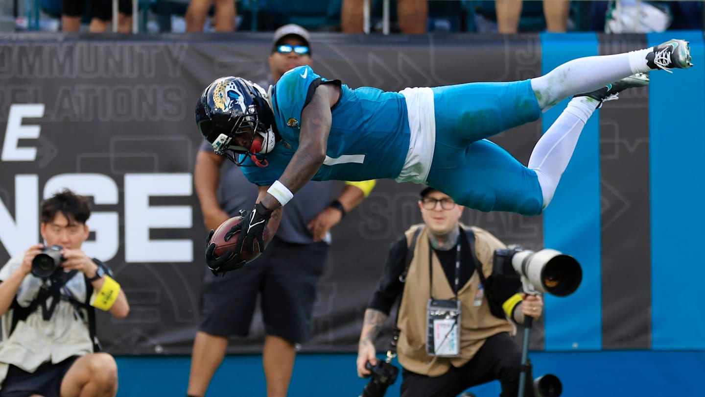 Jacksonville Jaguars running back Travis Etienne Jr. (1) leaps to score a rushing touchdown during the fourth quarter of an NFL football matchup at EverBank Stadium, Sunday, Dec. 14, 2025, in Jacksonville, Fla. The Jaguars defeated the Jets 48-20.
