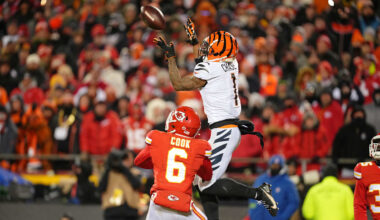 Jan 29, 2023; Kansas City, Missouri, USA; Cincinnati Bengals wide receiver Ja'Marr Chase (1) makes a catch against Kansas City Chiefs safety Bryan Cook (6) during the third quarter of the AFC Championship game at GEHA Field at Arrowhead Stadium. Mandatory Credit: Jay Biggerstaff-Imagn Images