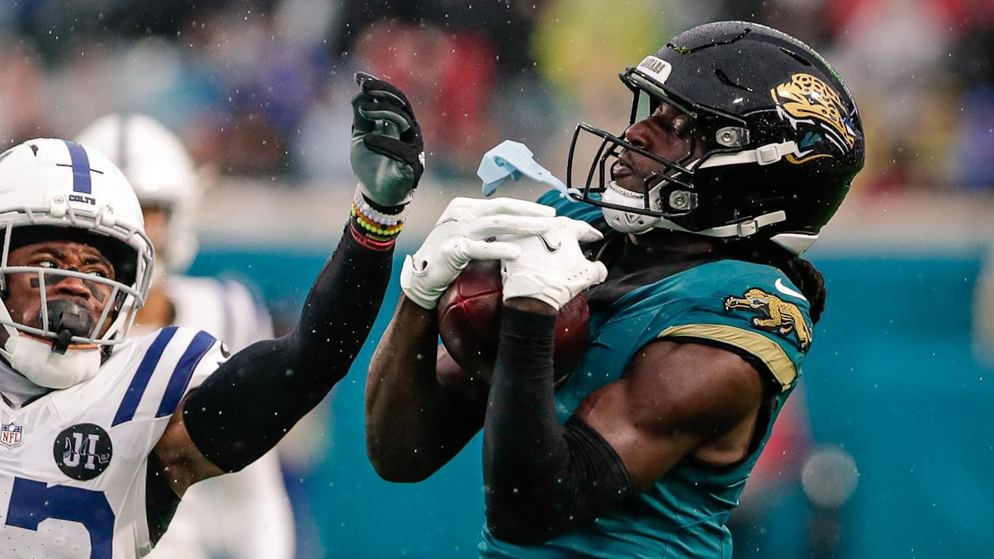 Dec 7, 2025; Jacksonville, Florida, USA; Jacksonville Jaguars wide receiver Brian Thomas Jr. (7) catches a pass over Indianapolis Colts cornerback Kenny Moore II (23) at EverBank Stadium.