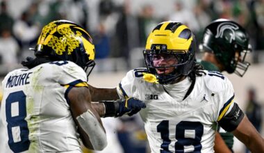 Michigan's Derrick Moore, left, celebrates a sack with Troy Bowles during the fourth quarter in the game against Michigan State on Saturday, Oct. 25, 2025, at Spartan Stadium in East Lansing.