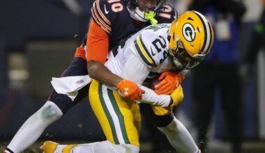 Jan 10, 2026; Chicago, IL, USA; Green Bay Packers cornerback Carrington Valentine (24) is tackled by Chicago Bears wide receiver Luther Burden III (10) after intercepting a pass during an NFC Wild Card Round game at Soldier Field.