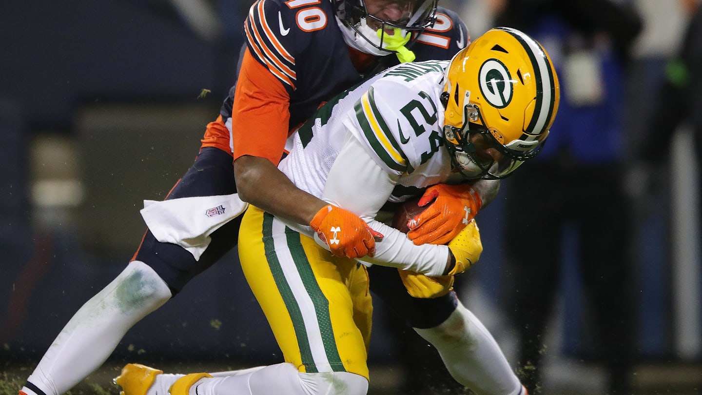 Jan 10, 2026; Chicago, IL, USA; Green Bay Packers cornerback Carrington Valentine (24) is tackled by Chicago Bears wide receiver Luther Burden III (10) after intercepting a pass during an NFC Wild Card Round game at Soldier Field.