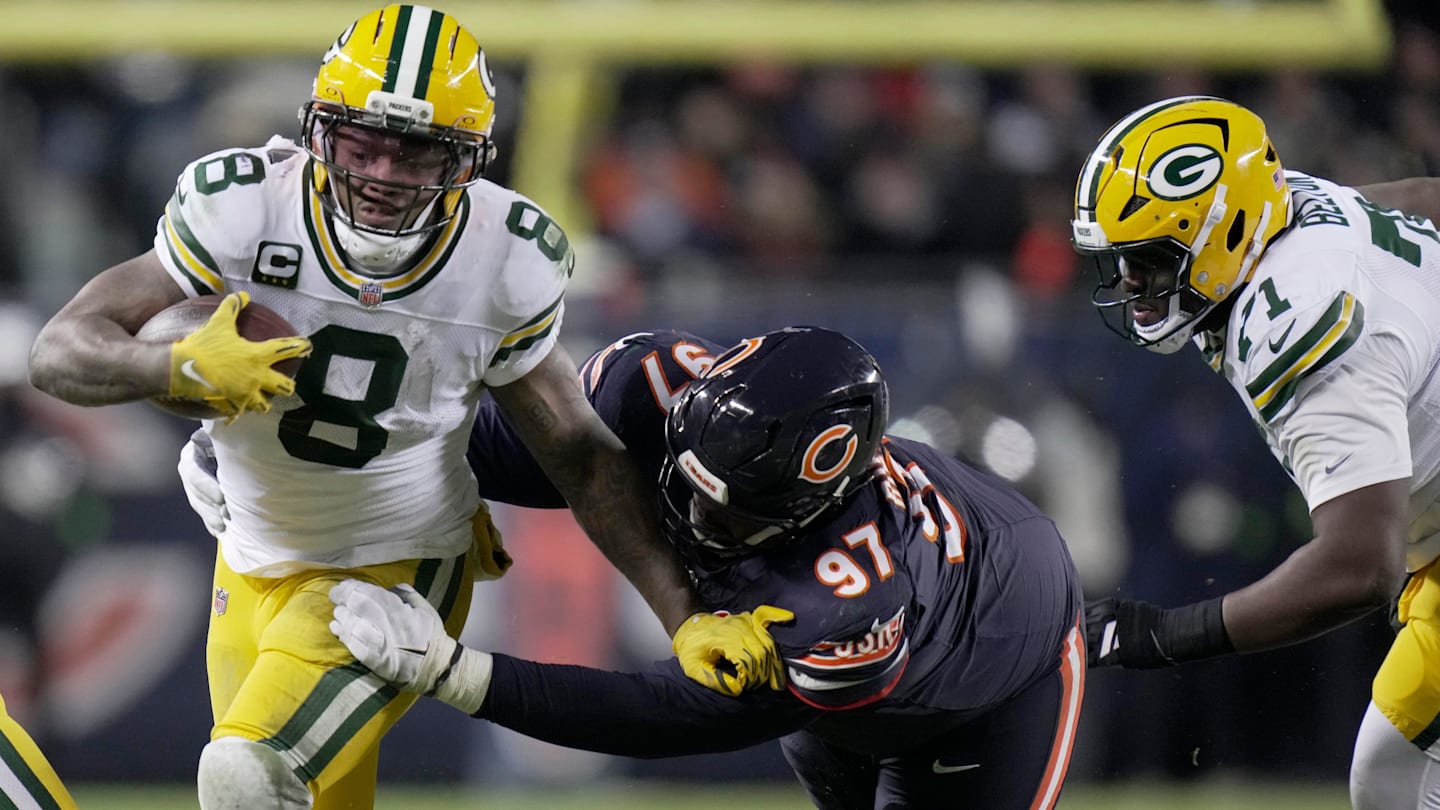 Green Bay Packers running back Josh Jacobs (8) is tackled by Chicago Bears defensive tackle Andrew Billings (97) during the second quarter of their wild card playoff game Saturday, January 10, 2026 at Soldier Field in Chicago, Illinois.