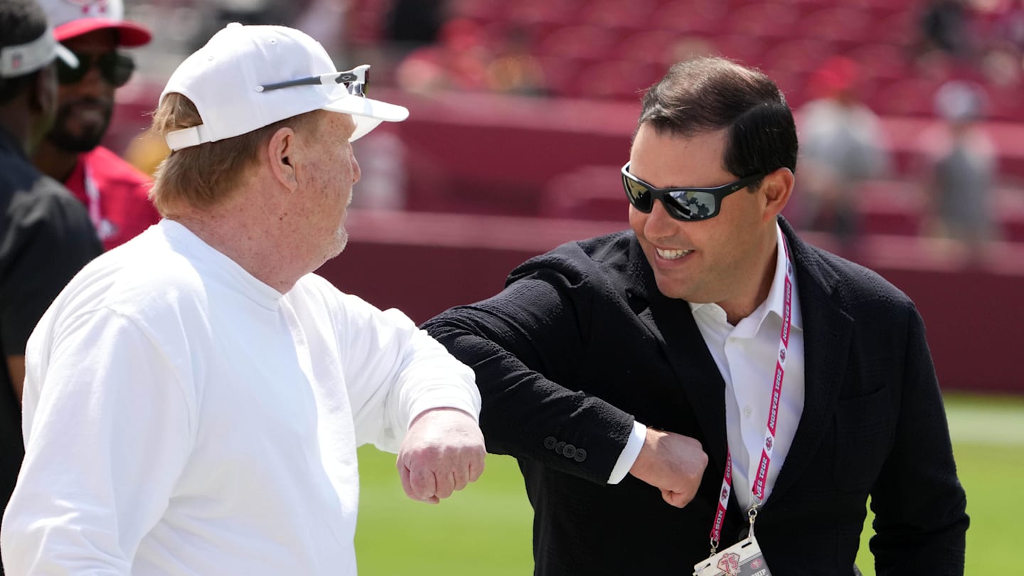 Las Vegas Raiders owner Mark Davis (left) bumps elbows with San Francisco 49ers chief executive officer Jed York  (right)