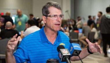Mar 31, 2026; Phoenix, AZ, USA; Los Angeles Chargers head coach Jim Harbaugh speaks to reporters in the media during the 2026 NFL Annual League Meeting at the Arizona Biltmore. Mandatory Credit: Mark J. Rebilas-Imagn Images