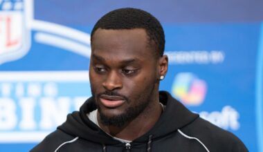 Notre Dame running back Jeremiyah Love (RB11) speaks to members of the media during the NFL Combine.