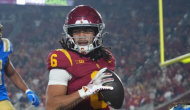 Nov 29, 2025; Los Angeles, California, USA; Southern California Trojans wide receiver Makai Lemon (6) catches a 32-yard touchdown pass against UCLA Bruins defensive back Kanye Clark (1) in the second half at United Airlines Field at Los Angeles Memorial Coliseum. Mandatory Credit: Kirby Lee-Imagn Images