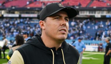 Dec 28, 2025; Nashville, Tennessee, USA;  New Orleans Saints head coach Kellen Moore leaves the field against the Tennessee Titans during the second half at Nissan Stadium. Mandatory Credit: Steve Roberts-Imagn Images