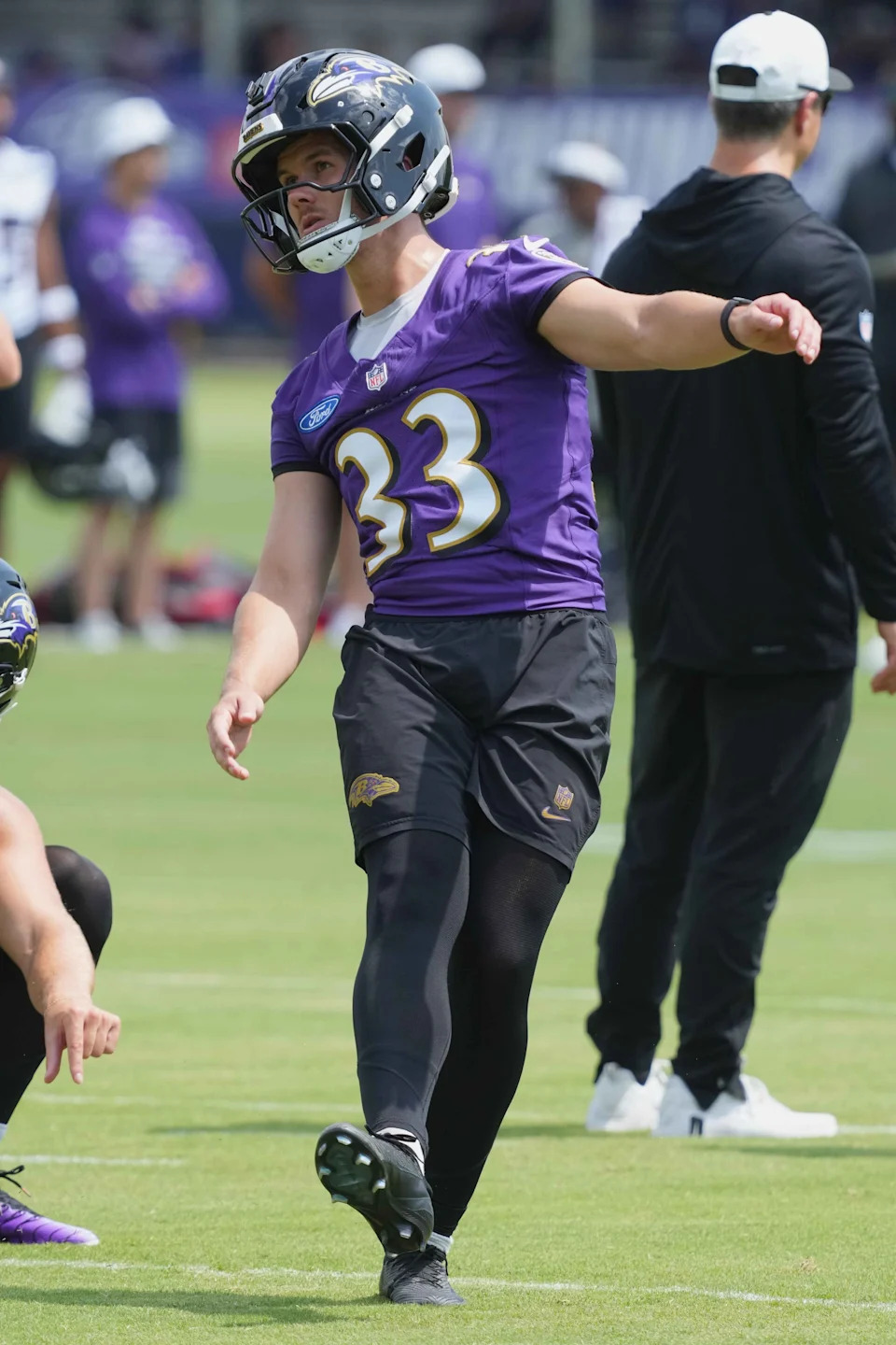 Jul 23, 2025; Owings Mills, MD, USA; Baltimore Ravens kicker Tyler Loop (33) warms up during training camp at Under Armour Performance Center. Mandatory Credit: Mitch Stringer-Imagn Images