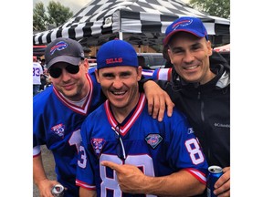 Buffalo Bills International Fan of the Year Darryl Russell (middle) with his step-brother Rob Johnson (left) and brother Jason Russell.