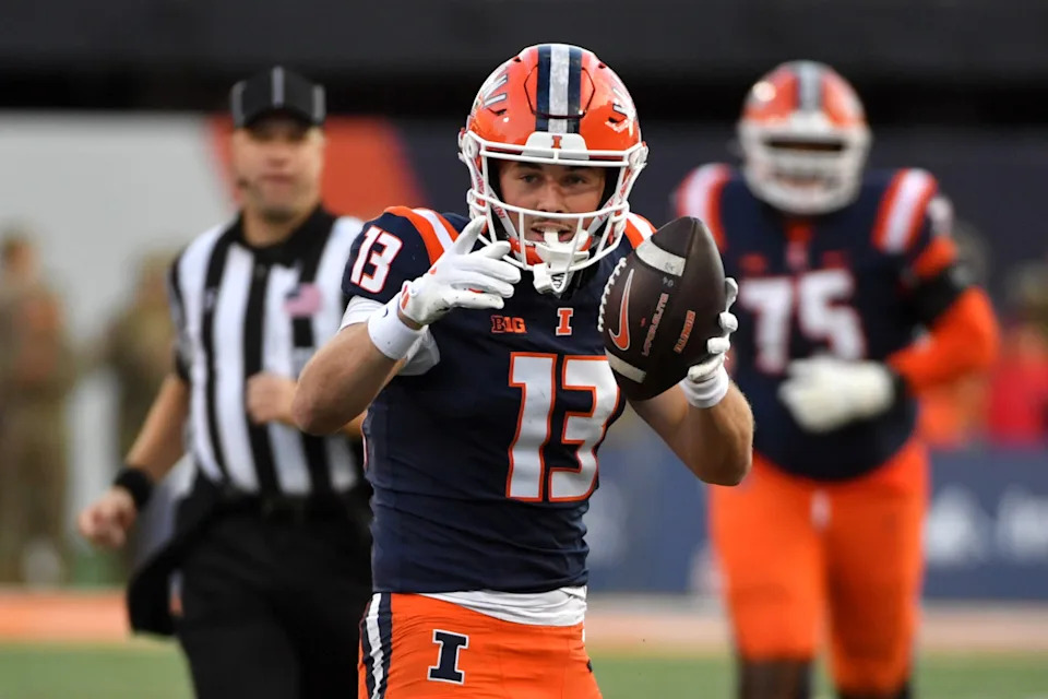 Nov 15, 2025; Champaign, Illinois, USA; Illinois Fighting Illini wide receiver Hudson Clement (13) reacts after a catch and run during the first half against the Maryland Terrapins at Memorial Stadium. © Ron Johnson-Imagn Images