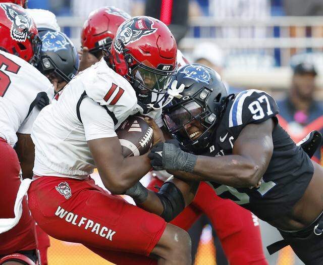 Duke’s Wesley Williams pressures N.C. State quarterback CJ Bailey during the second half of the Blue Devils’ 45-33 win on Sept. 20, 2025, at Wallace Wade Stadium in Durham.