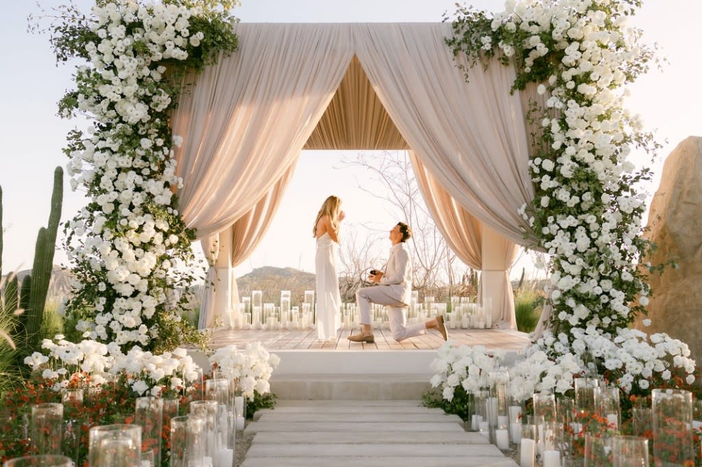 Derek Green got down on one knee under a flower-filled arch surrounded by glowing candles and proposed to Gracie Hunt. Instagram / @graciehunt