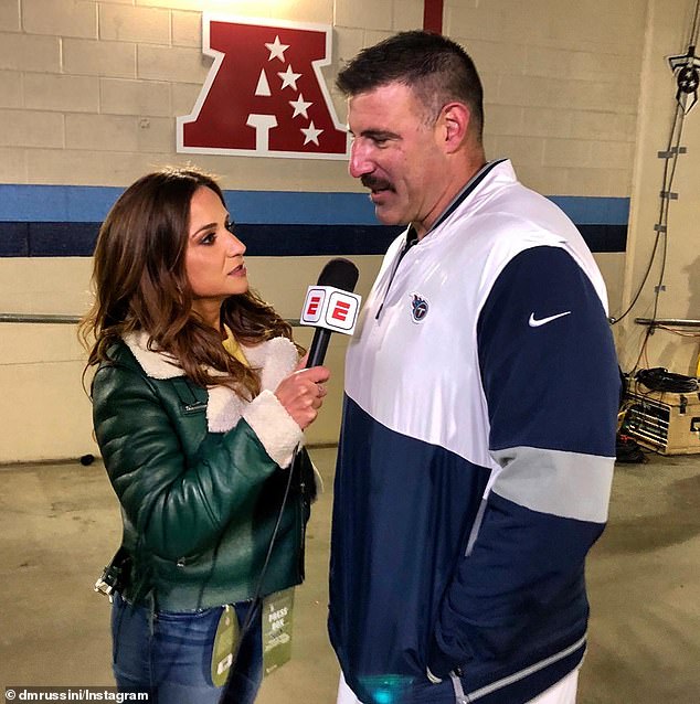 Russini is pictured interviewing Vrabel in 2019, when he was coaching the Titans