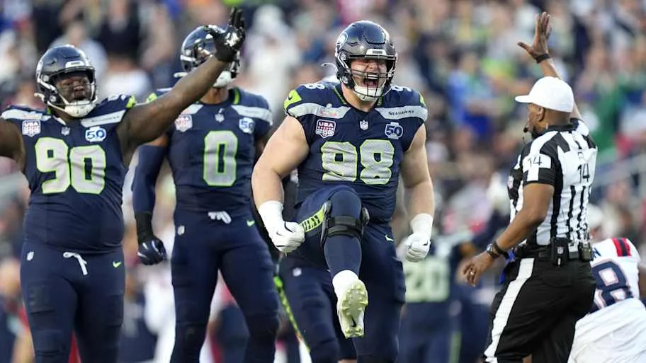 Seattle Seahawks defensive tackle Rylie Mills (98) reacts after sacking New England Patriots quarterback Drake Maye