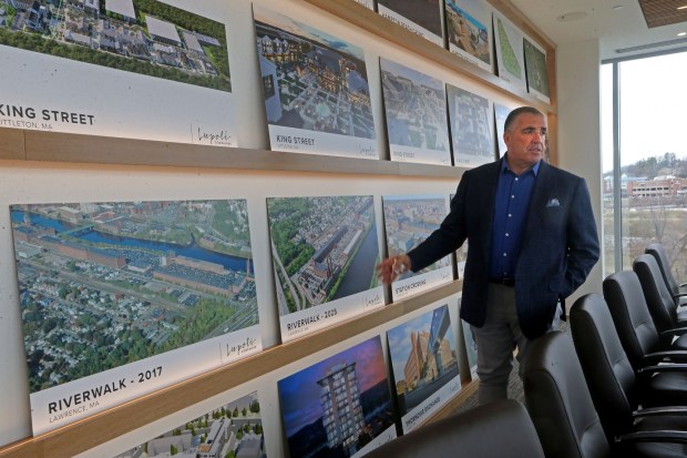 All the project's in Sal's office tell the story of a growing company. (Stuart Cahill/Boston Herald)