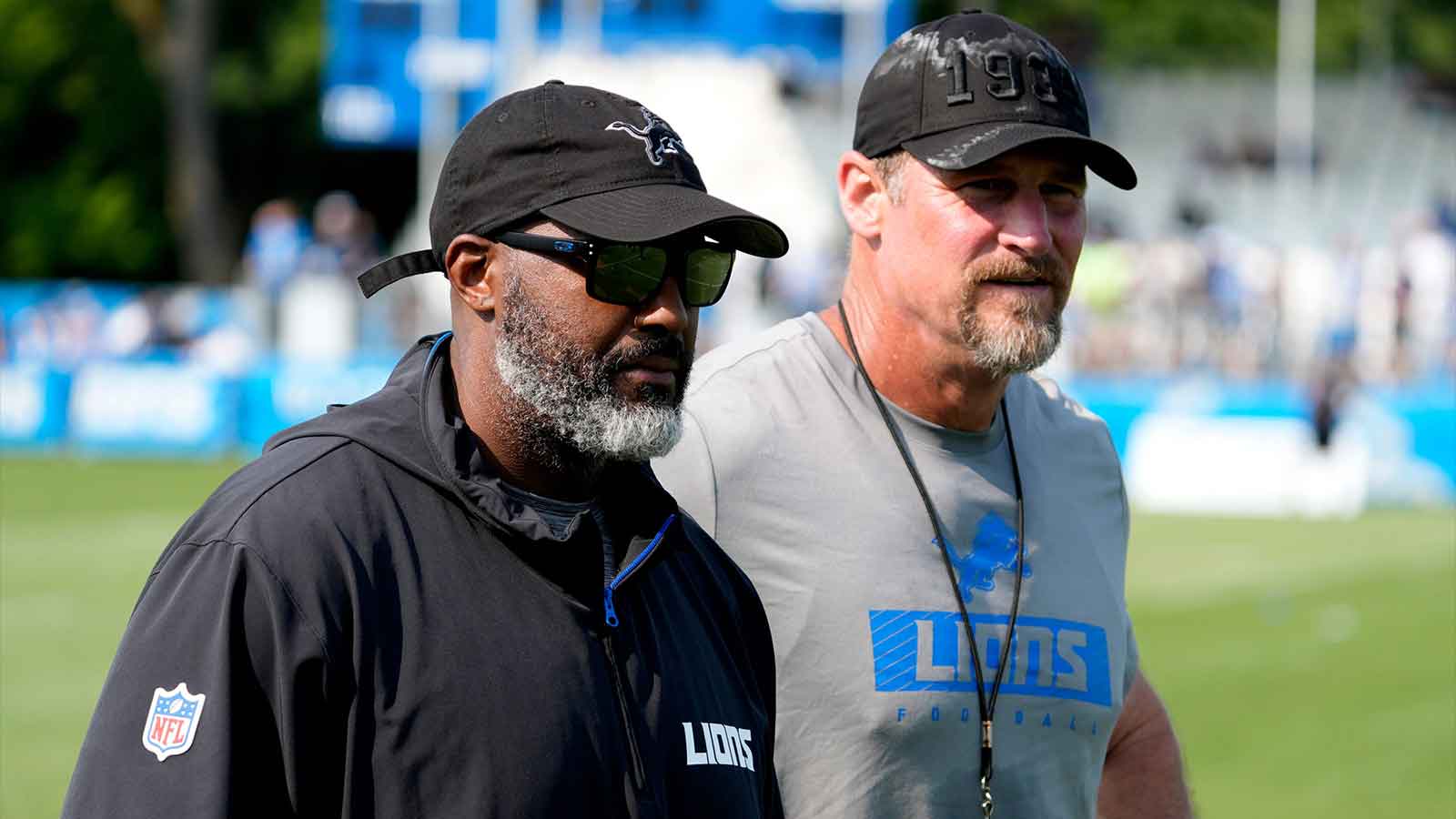 Detroit Lions executive vice president and general manager Brad Holmes, left, and Lions head coach Dan Campbell head off the practice field at the team's training facility in Allen Park on Wednesday, Aug. 14, 2024.