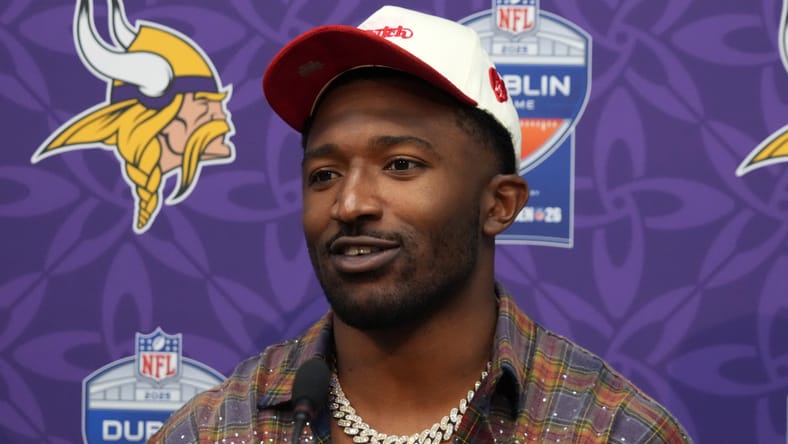 Jonathan Greenard speaks at a press conference after a Vikings game in Dublin, Ireland.