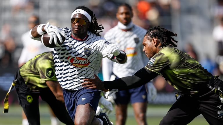 Founders FFC's Ashton Jeanty has his flag pulled by Wildcats...