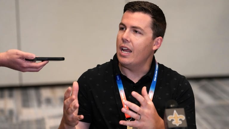 New Orleans Saints head coach Kellen Moore speaks to reporters...