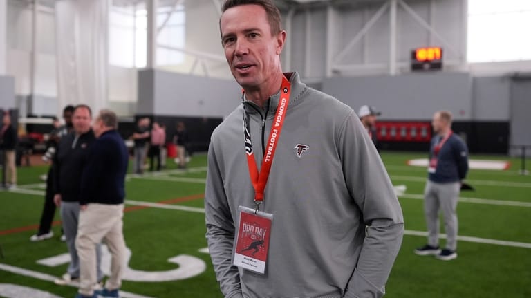 Atlanta Falcons' President of Football Matt Ryan walks on the...