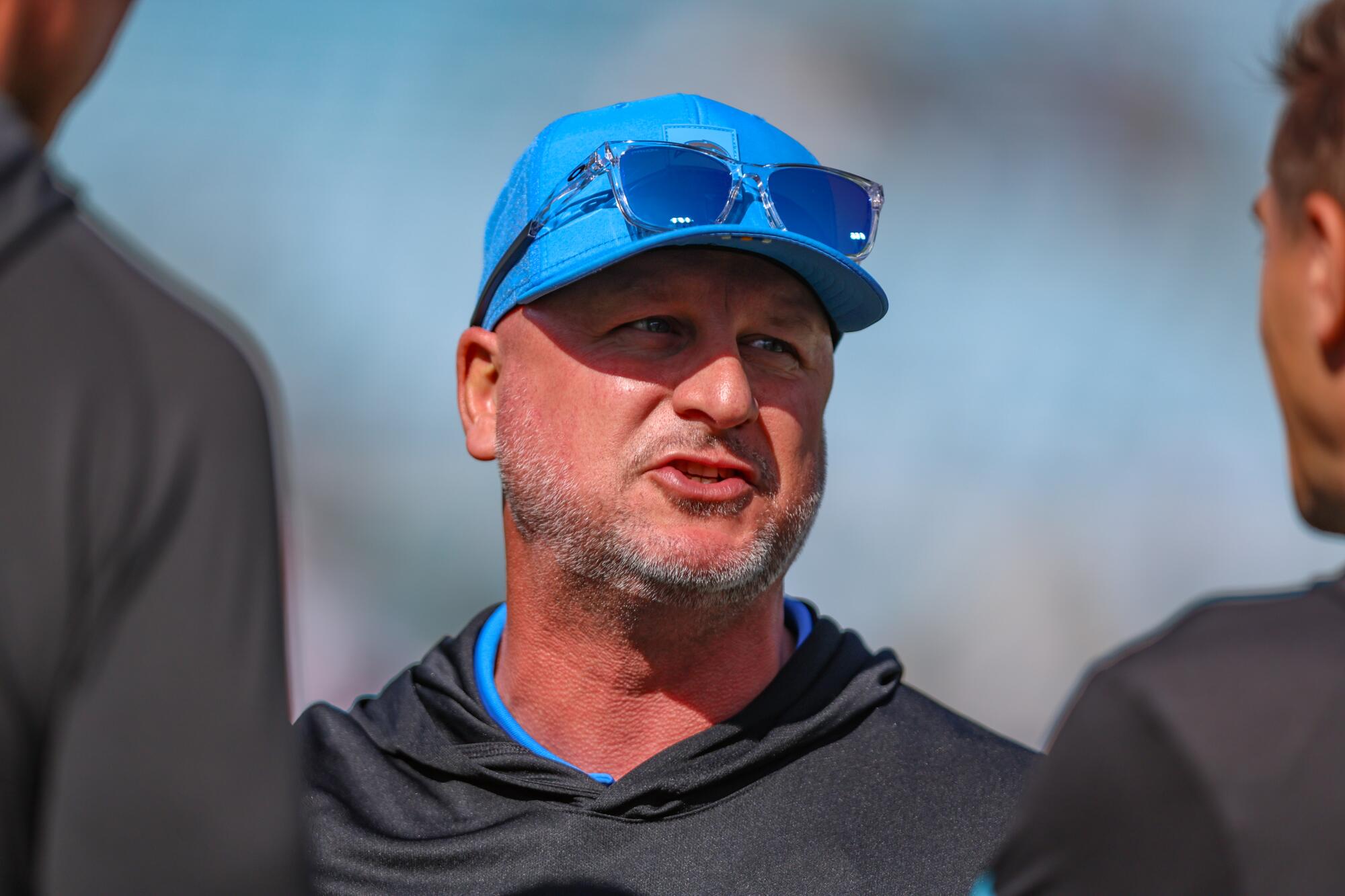 Chargers general manager Joe Hortiz talks on the sideline before a game against the Jacksonville Jaguars in November.