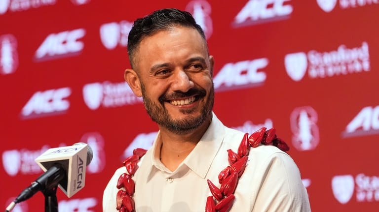 Tavita Pritchard speaks while being introduced as Stanford's new head...
