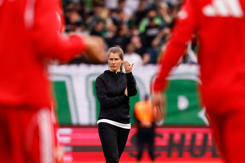 Eta walks onto the pitch after the match against Wolfsburg in Berlin on April 18.