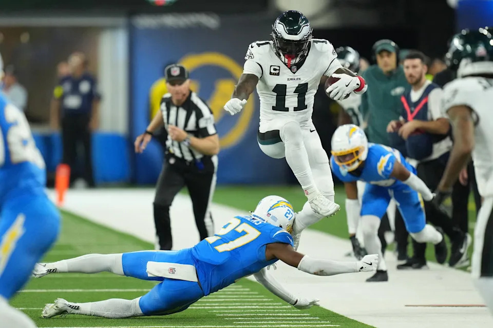 Dec 8, 2025; Inglewood, California, USA; Philadelphia Eagles wide receiver A.J. Brown (11) runs against Los Angeles Chargers safety RJ Mickens (27) in the second half at SoFi Stadium. Mandatory Credit: Kirby Lee-Imagn Images