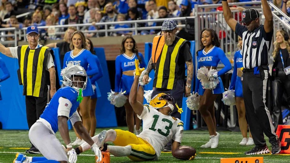 Nov 27, 2025; Detroit, Michigan, USA; Green Bay Packers wide receiver Dontayvion Wicks (13) looks for a touchdown signal from the referee against the Detroit Lions the third quarter at Ford Field. Mandatory Credit: David Reginek-Imagn Images