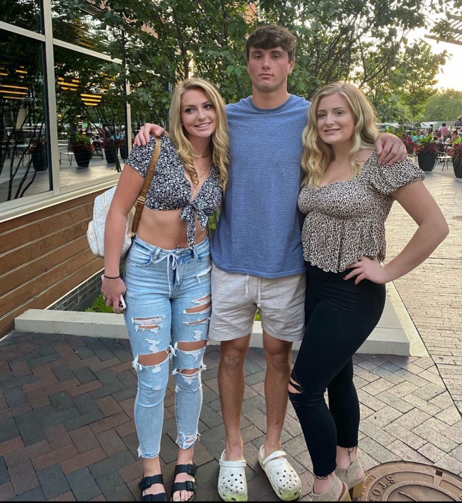Former Wisconsin Badgers tight end Jack Pugh with two women.