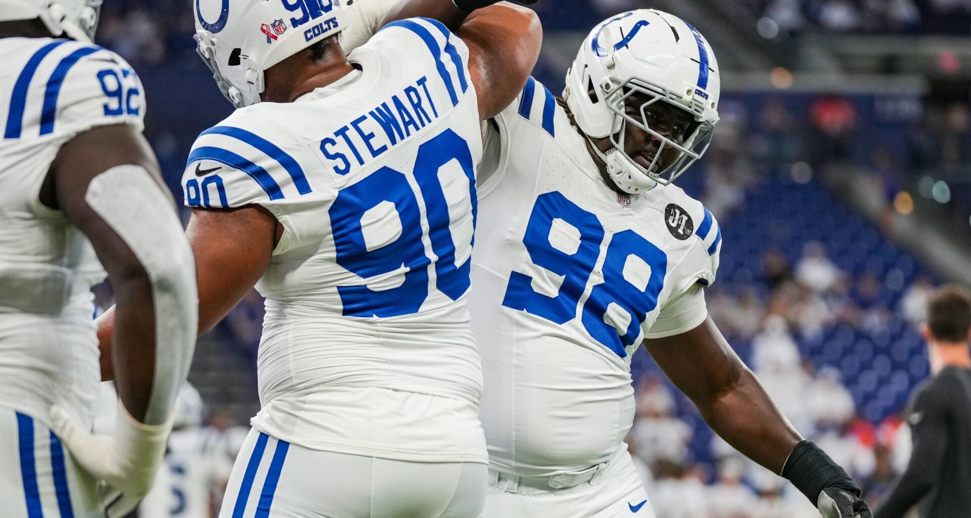 Indianapolis Colts defensive tackle Grover Stewart (90) locks arms with Indianapolis Colts defensive tackle Eric Johnson II (98) on Sunday, Sept. 14, 2025, ahead of the game against the Denver Broncos at Lucas Oil Stadium in Indianapolis.