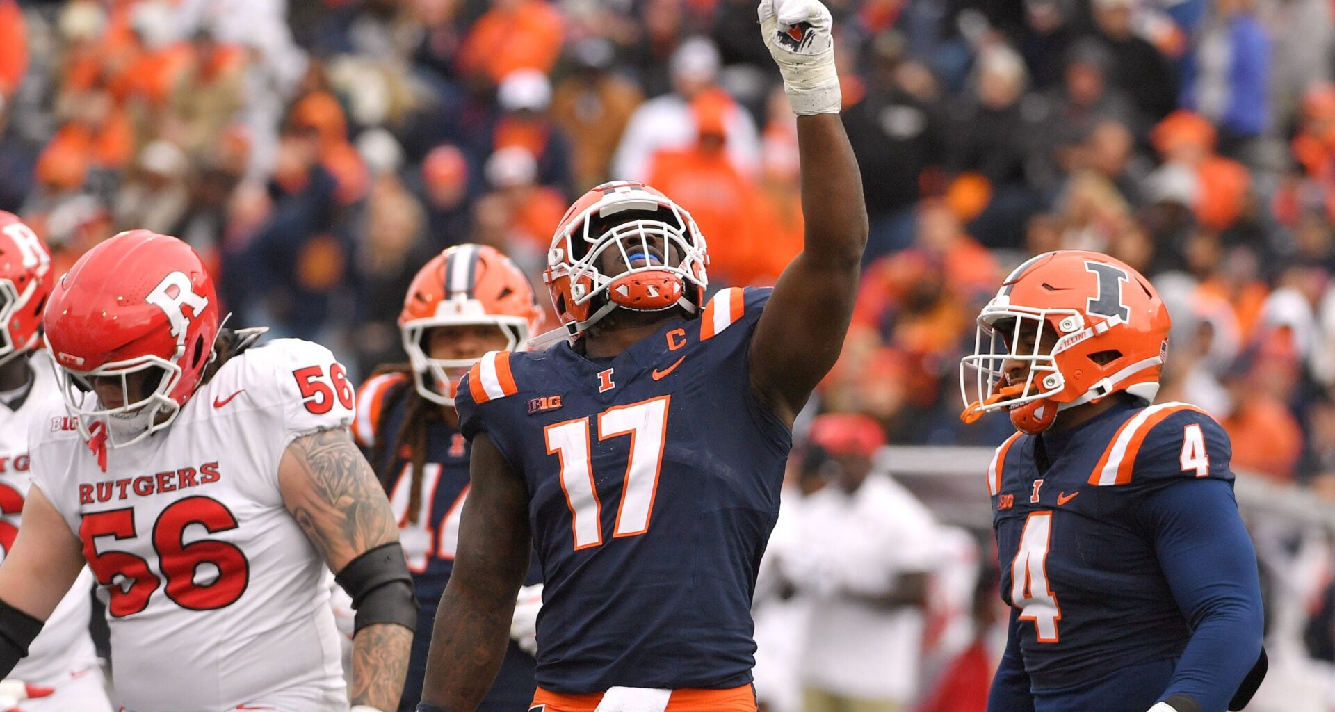 Nov 1, 2025; Champaign, Illinois, USA; Illinois Fighting Illini linebacker Gabe Jacas (17) celebrates his sack on Rutgers Scarlet Knights quarterback Athan Kaliakmanis (16) during the first half at Memorial Stadium.